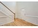 Inviting foyer with hardwood floors, a staircase, and decorative wall trim, leading to the main living areas at 4157 Medlock Woods Dr, Snellville, GA 30039