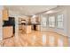 Spacious eat-in kitchen features hardwood floors and a large bay window for natural light at 4157 Medlock Woods Dr, Snellville, GA 30039