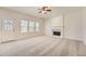 Bright living room with fireplace and windows, offering a comfortable living space at 4157 Medlock Woods Dr, Snellville, GA 30039