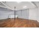 Unfinished basement space with hardwood floors and exposed ductwork at 4981 Crowe Se Dr, Smyrna, GA 30082