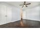 This bedroom features hardwood floors, a ceiling fan, and a spacious closet at 4981 Crowe Se Dr, Smyrna, GA 30082