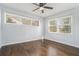 A spacious bedroom featuring natural light and beautiful hardwood floors at 4981 Crowe Se Dr, Smyrna, GA 30082