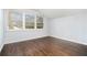This bright bedroom features hardwood floors and a large window at 4981 Crowe Se Dr, Smyrna, GA 30082
