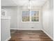 Cozy dining area boasts a stylish light fixture and warm wood flooring at 4981 Crowe Se Dr, Smyrna, GA 30082