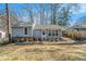Charming home with gray siding, tidy landscaping, and a convenient covered carport at 4981 Crowe Se Dr, Smyrna, GA 30082