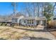 Attractive home showcasing its gray exterior and a practical covered parking area at 4981 Crowe Se Dr, Smyrna, GA 30082