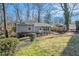 Well-maintained, one-story house with a covered carport and a partially-shaded lawn at 4981 Crowe Se Dr, Smyrna, GA 30082