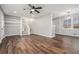 Open-concept living room features hardwood floors, a modern ceiling fan, and neutral paint at 4981 Crowe Se Dr, Smyrna, GA 30082