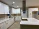 Bright kitchen features an eat-in island with a white countertop and ample counter space with stainless appliances at 1285 Mcclure Nw Ave, Atlanta, GA 30314