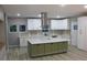 The kitchen boasts an eat-in island, stainless appliances, stylish pendant lights, and ample cabinet space at 1285 Mcclure Nw Ave, Atlanta, GA 30314