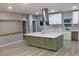 Bright kitchen features an oversized island with a white countertop and ample cabinet storage beneath at 1285 Mcclure Nw Ave, Atlanta, GA 30314