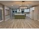 Open kitchen design boasts a large island, pantry, and stylish lighting fixtures for an inviting atmosphere at 1285 Mcclure Nw Ave, Atlanta, GA 30314