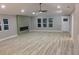 The living room features stylish flooring, an electric fireplace, large windows and a front door at 1285 Mcclure Nw Ave, Atlanta, GA 30314