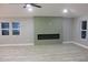 Bright living room featuring a modern fireplace and wood-look flooring at 1285 Mcclure Nw Ave, Atlanta, GA 30314