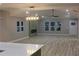 The living room features stylish flooring, a fireplace, large windows and modern lighting fixtures at 1285 Mcclure Nw Ave, Atlanta, GA 30314