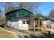 View of the house from the side showing the fenced yard and the modern, renovated architecture at 1285 Mcclure Nw Ave, Atlanta, GA 30314