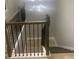 Interior staircase with a modern lighting fixture, dark wood trim, and neutral paint at 1285 Mcclure Nw Ave, Atlanta, GA 30314