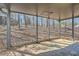 Covered back porch with views of the wooded backyard at 1669 Glen Arm Dr, Lithonia, GA 30058