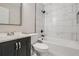 Modern bathroom featuring a tiled shower, soaking tub, sleek vanity, and neutral finishes at 1669 Glen Arm Dr, Lithonia, GA 30058