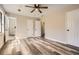 Spacious bedroom featuring multiple closets, access to ensuite bathroom, and durable gray vinyl flooring at 1669 Glen Arm Dr, Lithonia, GA 30058