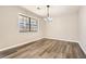 Bright dining room with hardwood floors and an elegant chandelier at 1669 Glen Arm Dr, Lithonia, GA 30058