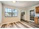 Bright dining room featuring durable gray vinyl flooring and a large window with natural light at 1669 Glen Arm Dr, Lithonia, GA 30058