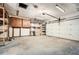 Spacious garage with overhead lighting and a large roll-up door at 1669 Glen Arm Dr, Lithonia, GA 30058