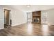 Bright living room with hardwood floors, brick fireplace, and abundant natural light at 1669 Glen Arm Dr, Lithonia, GA 30058