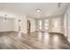 Spacious living room with modern hardwood floors and plenty of natural light at 1669 Glen Arm Dr, Lithonia, GA 30058