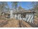 Rear exterior of home showing siding, covered porch, and roofline at 1669 Glen Arm Dr, Lithonia, GA 30058