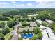 Aerial shot displays the community with a pool, buildings, and trees at 220 Chastain Park Ne Dr, Atlanta, GA 30342