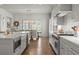 Bright, expansive kitchen with stainless steel appliances and a dining area beyond at 220 Chastain Park Ne Dr, Atlanta, GA 30342