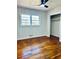 A bedroom with hardwood floors, a window, and a closet at 2213 Sandtown Sw Rd, Marietta, GA 30060