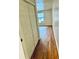 Bright bedroom features a closet, hardwood floors, and a window at 2213 Sandtown Sw Rd, Marietta, GA 30060