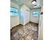 Bright bedroom with large windows, tile flooring, and ample natural light at 2213 Sandtown Sw Rd, Marietta, GA 30060
