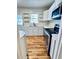 Charming kitchen featuring updated stainless appliances, lots of counter space, and sleek white cabinets at 2213 Sandtown Sw Rd, Marietta, GA 30060