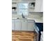 Bright kitchen showcasing white cabinets, new countertops, stainless appliances, and a lovely view at 2213 Sandtown Sw Rd, Marietta, GA 30060