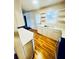 Functional kitchen area with white countertops, shaker cabinets, and an exterior access door at 2213 Sandtown Sw Rd, Marietta, GA 30060