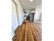 Spacious living room showcasing hardwood floors leading to a modern updated kitchen and Stainless appliances at 2213 Sandtown Sw Rd, Marietta, GA 30060