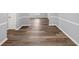 Finished basement area with chair rail molding and wood-look flooring at 5724 Antelope Trl, Atlanta, GA 30349
