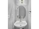 Bright bathroom with stylish oval mirror, modern lighting, and sleek fixtures at 5724 Antelope Trl, Atlanta, GA 30349