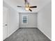 Cozy bedroom with neutral walls, carpet flooring, ceiling fan and a window at 5724 Antelope Trl, Atlanta, GA 30349