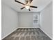 Neutral bedroom featuring modern ceiling fan, plush carpet and natural light at 5724 Antelope Trl, Atlanta, GA 30349