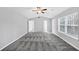 Bright bedroom boasts neutral walls, plush gray carpet, and natural light from the window at 5724 Antelope Trl, Atlanta, GA 30349