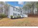 Side view of a two-story home featuring a well-manicured lawn and mature trees at 5724 Antelope Trl, Atlanta, GA 30349