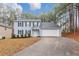 Charming two-story home with blue siding, black shutters, and well-maintained landscaping at 5724 Antelope Trl, Atlanta, GA 30349