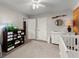 Bedroom featuring white dresser with changing table, fish tank, and soft carpeting at 3043 Chelsea Ln, Acworth, GA 30102