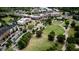 Aerial view of the community's town green, walking paths, shops, and surrounding apartments at 4569 Campenille Trce, Suwanee, GA 30024