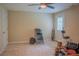 Basement area features a ceiling fan, tiled floors, and a doorway providing convenient access at 4569 Campenille Trce, Suwanee, GA 30024