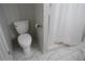 Bright bathroom featuring a toilet, and a shower with white tile surround at 4569 Campenille Trce, Suwanee, GA 30024